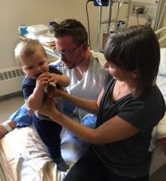Brodie with his wife and son in hospital