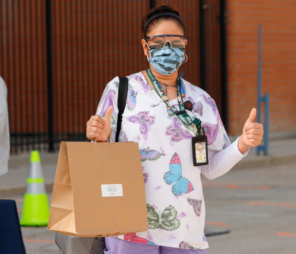 HSC nurse receiving a donated meal