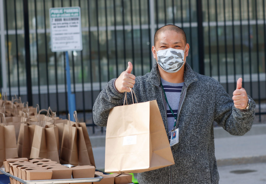 HSC staff distributing donated meals
