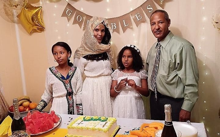 Bereket Ezuz with his wife and daughters.